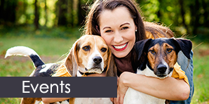 Woman Hugging Dogs - Dog Training Services